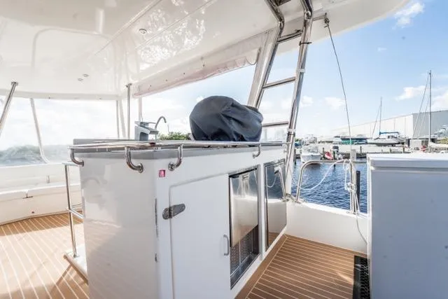 Catfish Yacht Photos Pics 2017 Leopard 51 Powercat yacht deck with outdoor kitchen and marina view.