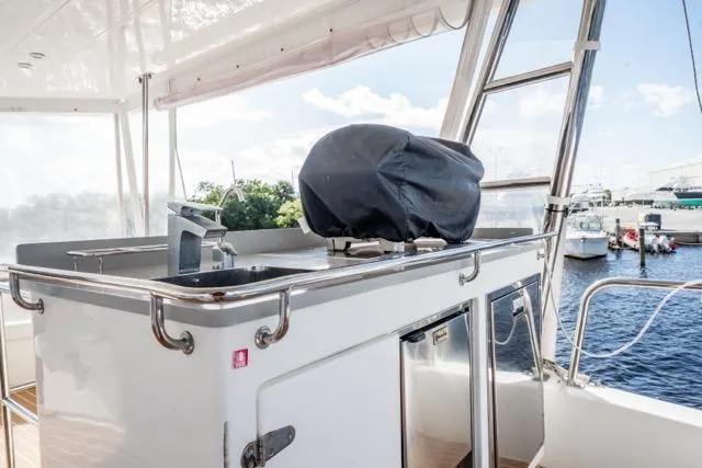 Catfish Yacht Photos Pics Outdoor kitchen on 2017 Leopard 51 Powercat yacht with sink and covered grill.