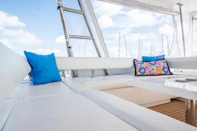 Catfish Yacht Photos Pics Luxurious seating area on 2017 Leopard 51 Powercat with vibrant cushions and marina view.