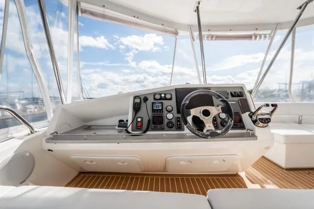 Catfish Yacht Photos Pics Helm of 2017 Leopard 51 Powercat with modern controls and panoramic view.