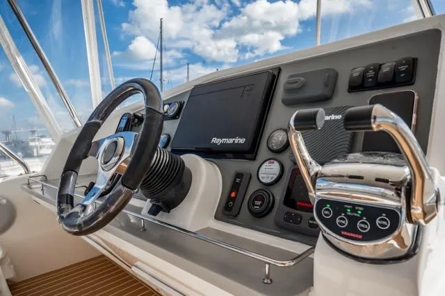 Catfish Yacht Photos Pics Cockpit of 2017 Leopard 51 Powercat with Raymarine navigation system and steering wheel.