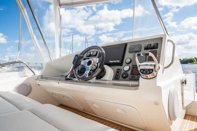 Catfish Yacht Photos Pics Helm of 2017 Leopard 51 Powercat with modern navigation equipment and steering wheel.
