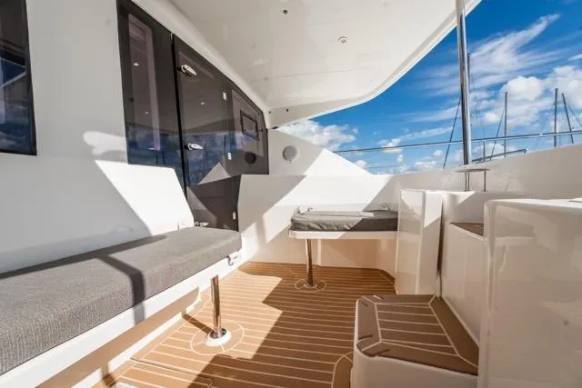 Catfish Yacht Photos Pics 2017 Leopard 51 Powercat yacht deck with seating, modern design, and ocean view.