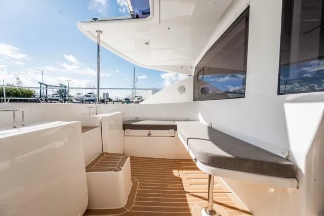 Catfish Yacht Photos Pics 2017 Leopard 51 Powercat yacht deck with cushioned seating and sleek design.