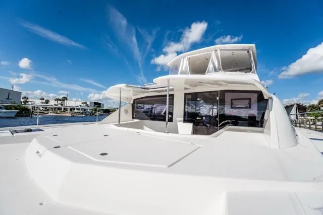 Catfish Yacht Photos Pics 2017 Leopard 51 Powercat yacht docked under a clear blue sky.
