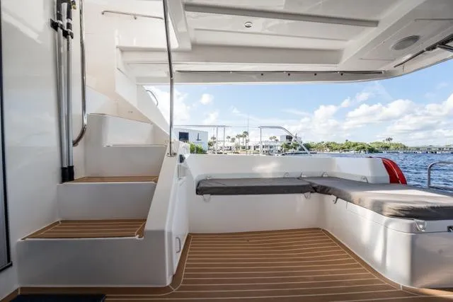 Catfish Yacht Photos Pics 2017 Leopard 51 Powercat interior with seating, stairs, and scenic water view.