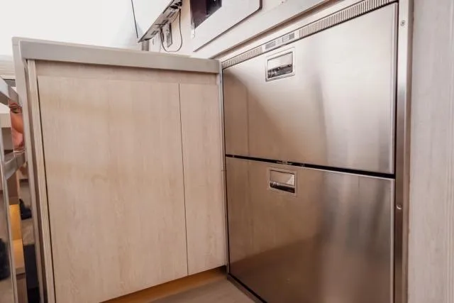 Catfish Yacht Photos Pics Modern kitchen area in 2017 Leopard 51 Powercat with stainless steel appliances.