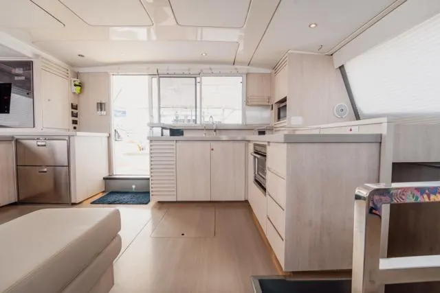 Catfish Yacht Photos Pics Modern kitchen interior of 2017 Leopard 51 Powercat yacht, featuring sleek cabinetry and appliances.