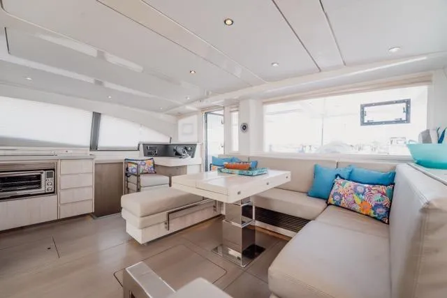 Catfish Yacht Photos Pics Luxurious interior of 2017 Leopard 51 Powercat with modern seating and vibrant cushions.