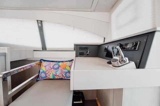 Catfish Yacht Photos Pics 2017 Leopard 51 Powercat interior helm with colorful cushion and modern controls.