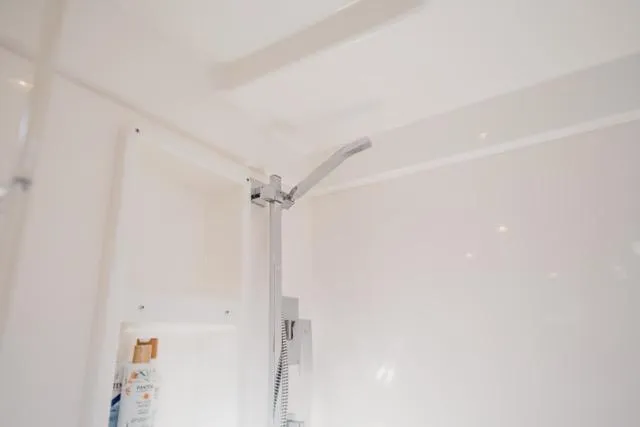 Catfish Yacht Photos Pics Shower area in 2017 Leopard 51 Powercat yacht, featuring modern fixtures and sleek design.