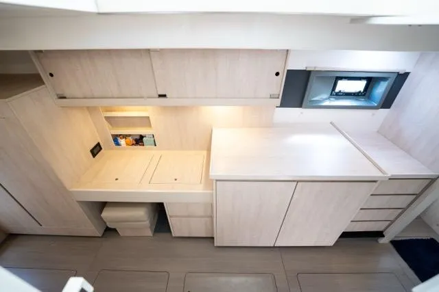 Catfish Yacht Photos Pics Modern interior of 2017 Leopard 51 Powercat with sleek cabinetry and compact design.