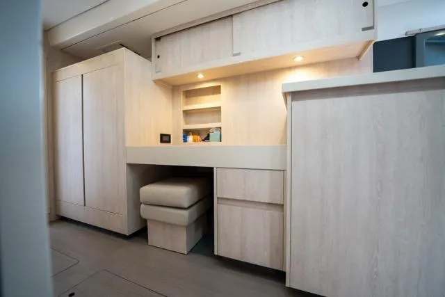 Catfish Yacht Photos Pics Interior of 2017 Leopard 51 Powercat yacht with modern wooden cabinetry and seating.