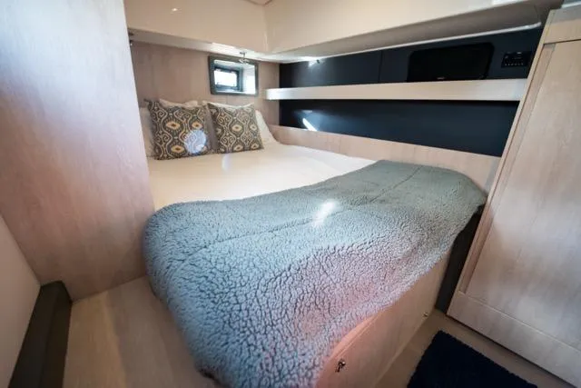 Catfish Yacht Photos Pics Cozy bedroom in 2017 Leopard 51 Powercat with plush bedding and modern design.