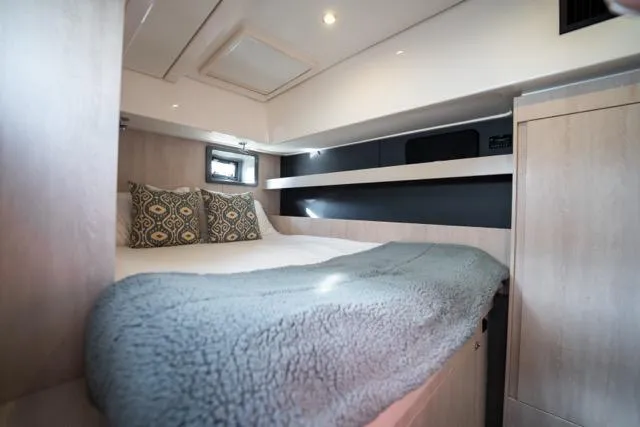 Catfish Yacht Photos Pics Cozy bedroom interior of 2017 Leopard 51 Powercat with plush bedding and modern design.