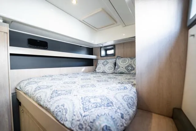 Catfish Yacht Photos Pics Cozy bedroom in 2017 Leopard 51 Powercat with patterned bedding and modern design.