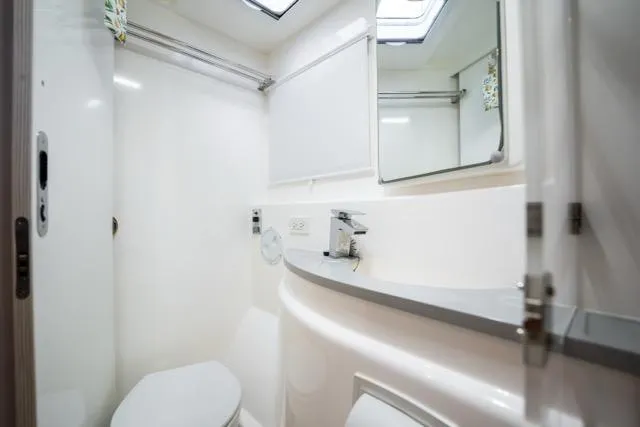 Catfish Yacht Photos Pics Modern bathroom interior on 2017 Leopard 51 Powercat yacht, featuring sleek design and fixtures.