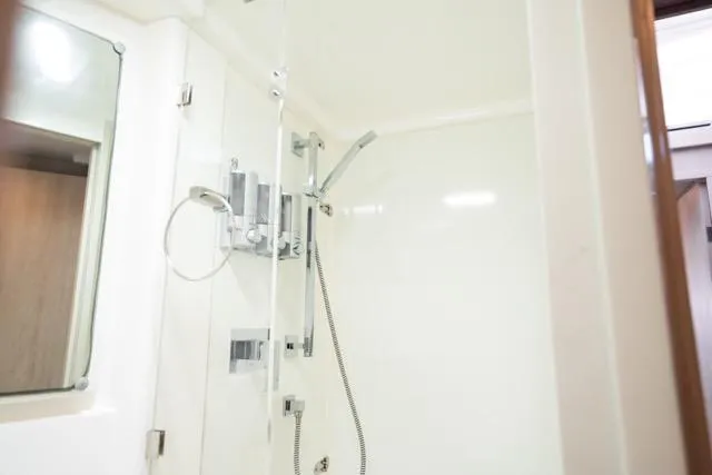 Catfish Yacht Photos Pics Shower area in 2017 Leopard 51 Powercat yacht, featuring modern fixtures and sleek design.