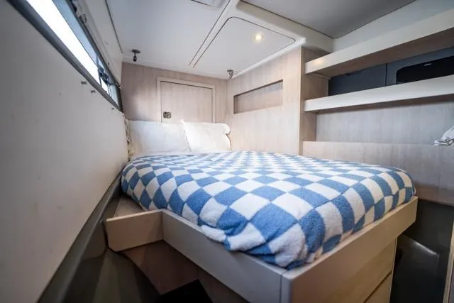 Catfish Yacht Photos Pics Cozy bedroom in 2017 Leopard 51 Powercat with checkered bedding and modern design.
