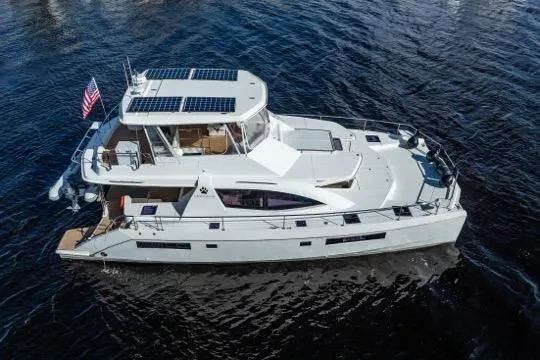 Catfish Yacht Photos Pics 2017 Leopard 51 Powercat yacht on water, featuring solar panels and sleek design.