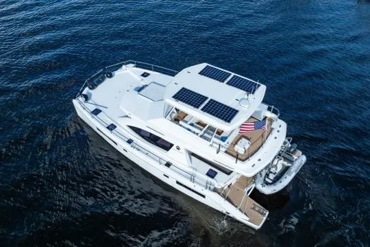 Catfish Yacht Photos Pics 2017 Leopard 51 Powercat yacht with solar panels, cruising on open water.