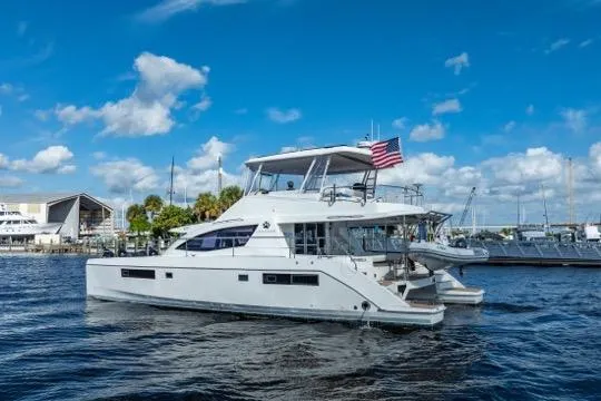 Catfish Yacht Photos Pics 2017 Leopard 51 Powercat yacht cruising on a sunny day with an American flag.