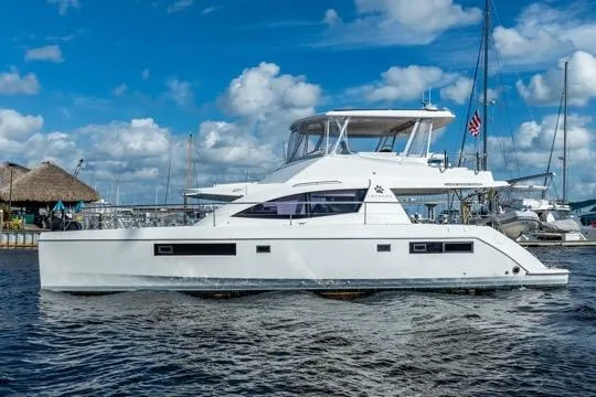 Catfish Yacht Photos Pics 2017 Leopard 51 Powercat yacht on water, clear sky background.