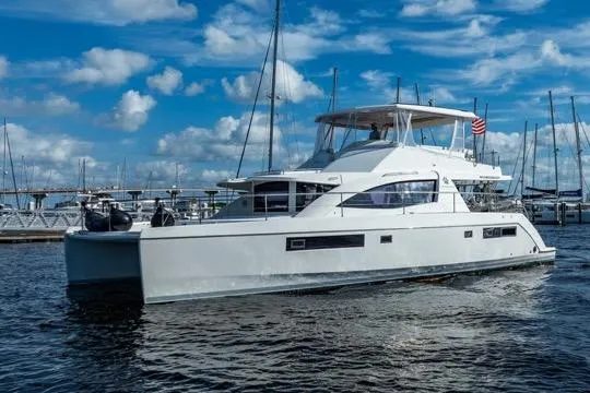 Catfish Yacht Photos Pics 2017 Leopard 51 Powercat yacht docked in marina under blue sky.