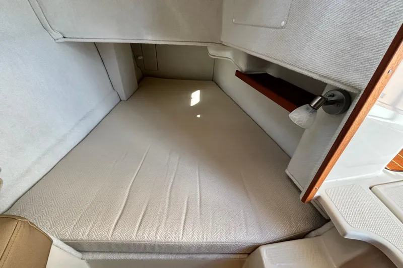  Yacht Photos Pics 2021 Ranger Tugs R-31 CB cabin interior with cozy sleeping area and reading light.