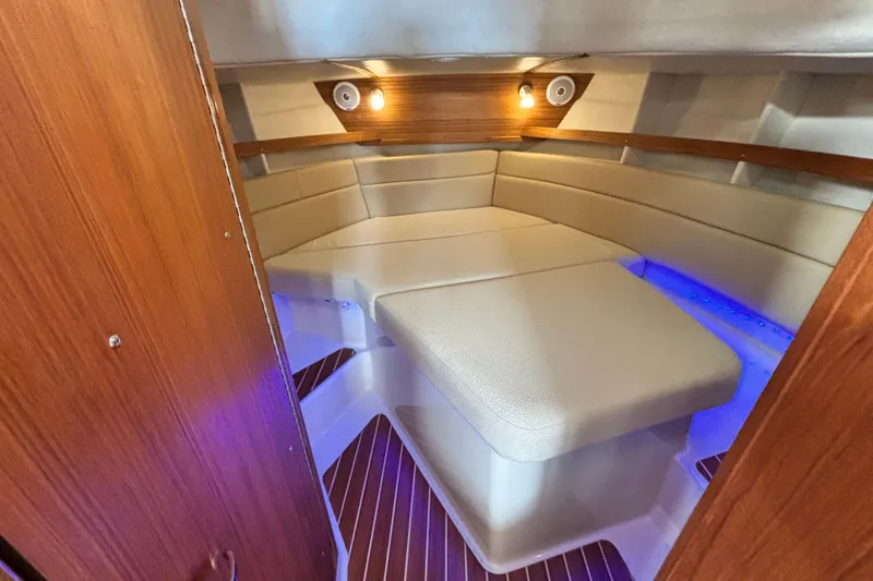  Yacht Photos Pics 2021 Ranger Tugs R-31 CB cabin interior with cozy seating and ambient lighting.