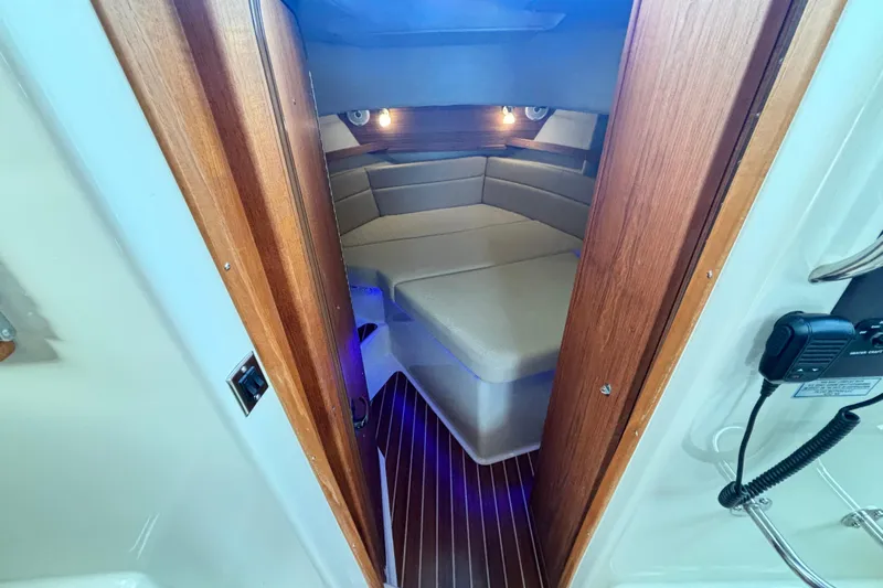  Yacht Photos Pics 2021 Ranger Tugs R-31 CB cabin interior with wood accents and cozy seating.