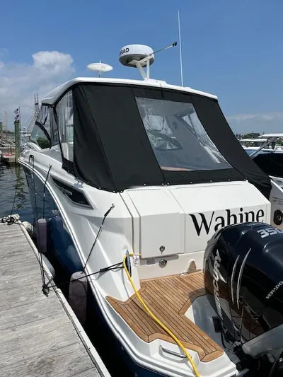 Wahine Yacht Photos Pics 2021 Sea Ray Sundancer 320 OB docked, featuring sleek design and powerful outboard engines.
