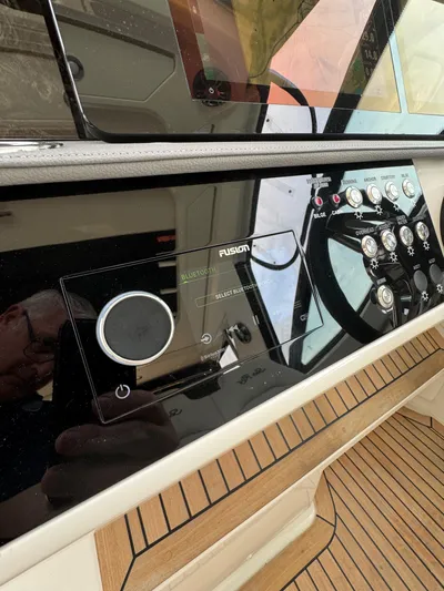 Wahine Yacht Photos Pics 2021 Sea Ray Sundancer 320 OB dashboard with controls and Fusion audio system.
