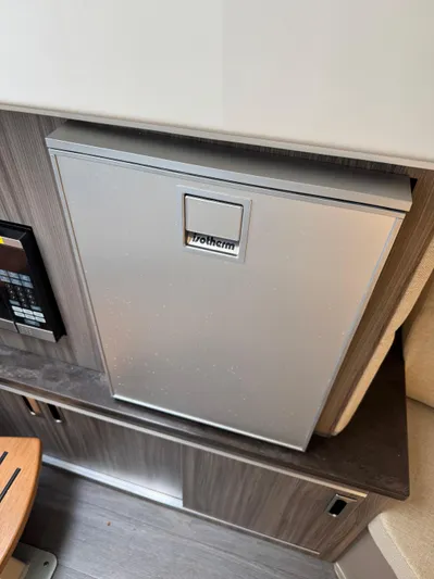 Wahine Yacht Photos Pics 2021 Sea Ray Sundancer 320 OB interior with a built-in Vitrifrigo refrigerator.