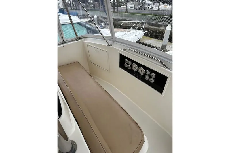 Reel'n In Style Yacht Photos Pics 1988 Ocean 44' Super Sport boat interior with control panel and seating.