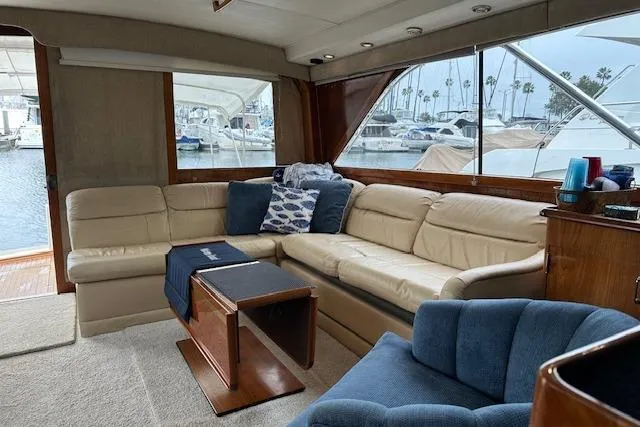 Reel'n In Style Yacht Photos Pics Luxurious interior of 1988 Ocean 44' Super Sport yacht with plush seating and marina view.