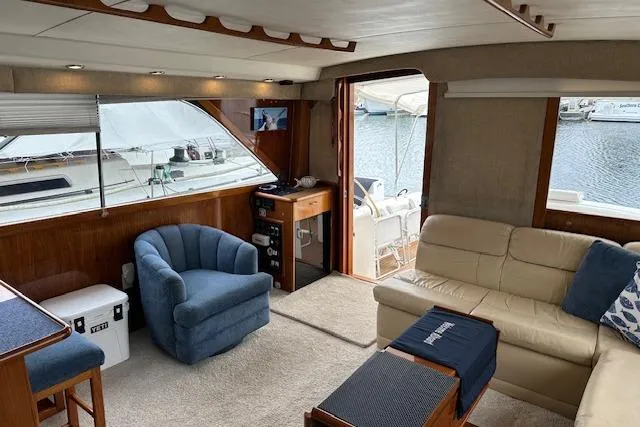 Reel'n In Style Yacht Photos Pics Interior of 1988 Ocean 44' Super Sport yacht with cozy seating and waterfront view.