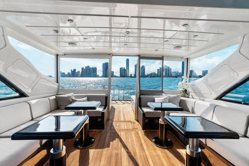 Payback Yacht Photos Pics Luxurious interior of 2007 Mangusta 80 Motoryacht with city skyline view.