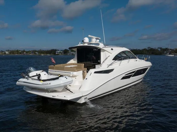  Yacht Photos Pics 2015 Sea Ray 510 Inboard Sundancer yacht cruising on a calm lake.