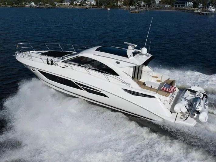  Yacht Photos Pics 2015 Sea Ray 510 Inboard Sundancer cruising on open water, displaying sleek design and powerful performance.