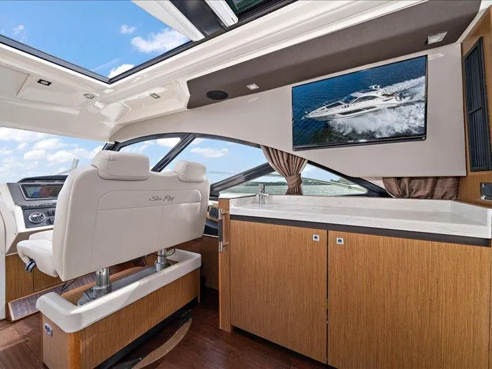 Yacht Photos Pics Luxurious interior of 2015 Sea Ray 510 Inboard Sundancer yacht with modern seating and cabinetry.