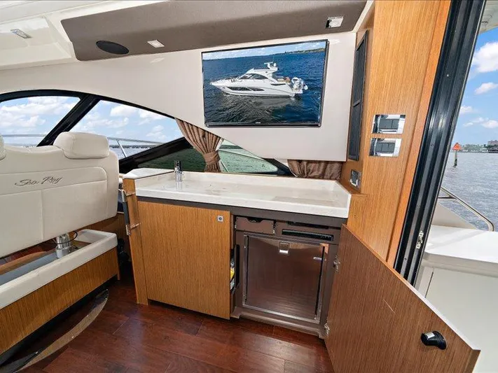  Yacht Photos Pics Interior of 2015 Sea Ray 510 Inboard Sundancer yacht with modern kitchenette and seating.