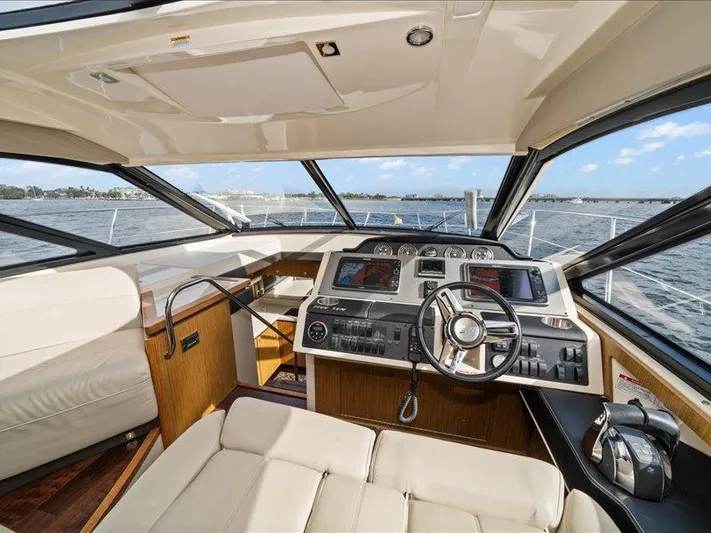 Yacht Photos Pics 2015 Sea Ray 510 Inboard Sundancer helm with luxurious interior and advanced navigation controls.