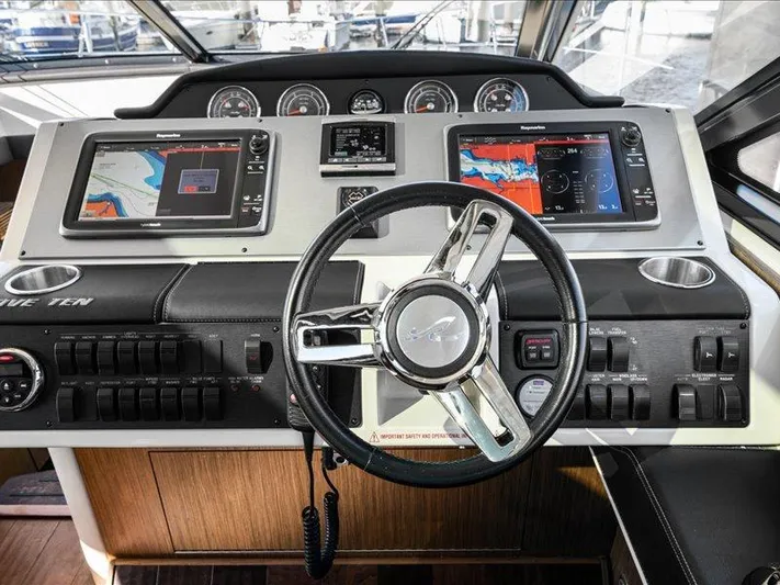  Yacht Photos Pics Helm of 2015 Sea Ray 510 Inboard Sundancer with navigation screens and controls.