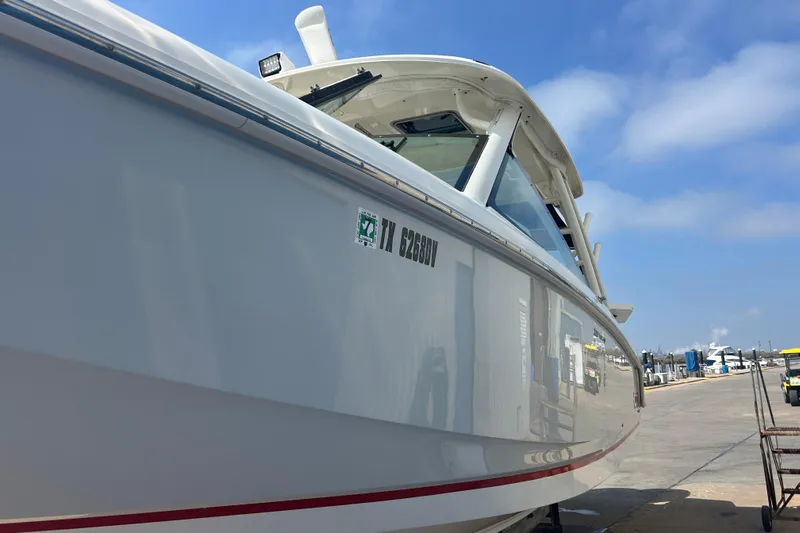  Yacht Photos Pics 2017 Boston Whaler 320 Vantage boat docked under clear blue sky.