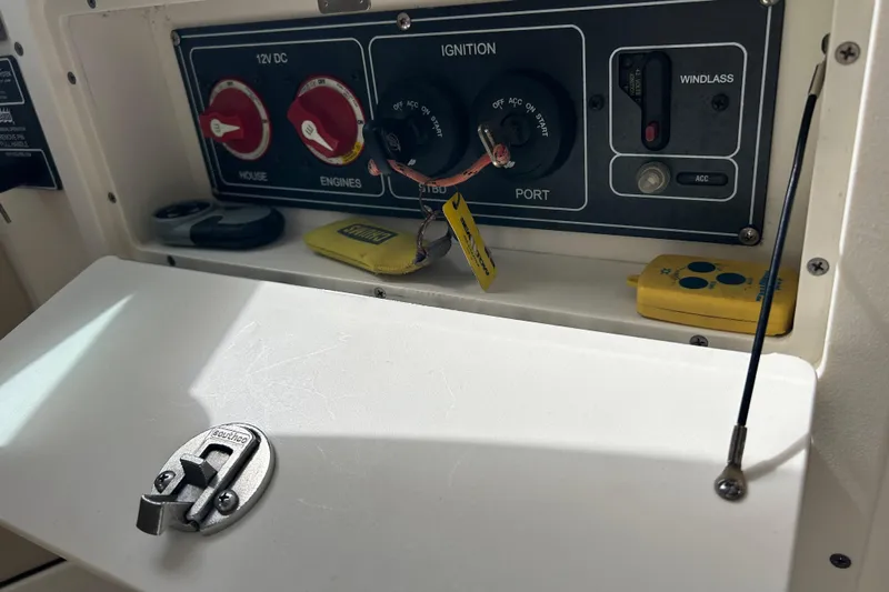  Yacht Photos Pics Control panel of a 2017 Boston Whaler 320 Vantage boat, featuring ignition and switches.