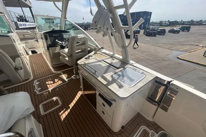  Yacht Photos Pics 2017 Boston Whaler 320 Vantage boat interior with helm and seating area.