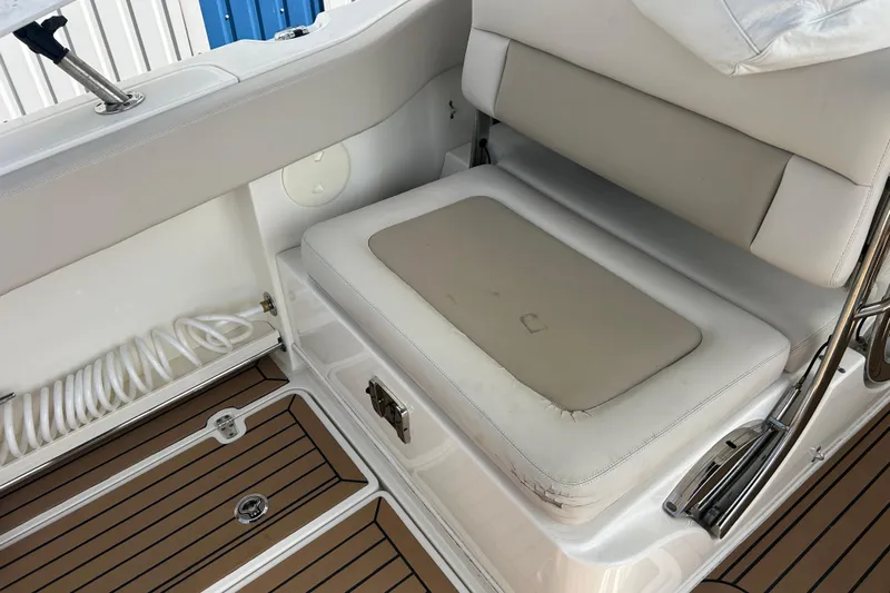  Yacht Photos Pics 2017 Boston Whaler 320 Vantage interior seating with cushioned bench and teak flooring.
