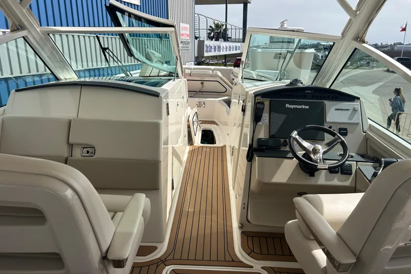  Yacht Photos Pics 2017 Boston Whaler 320 Vantage boat interior with Raymarine navigation system and seating.