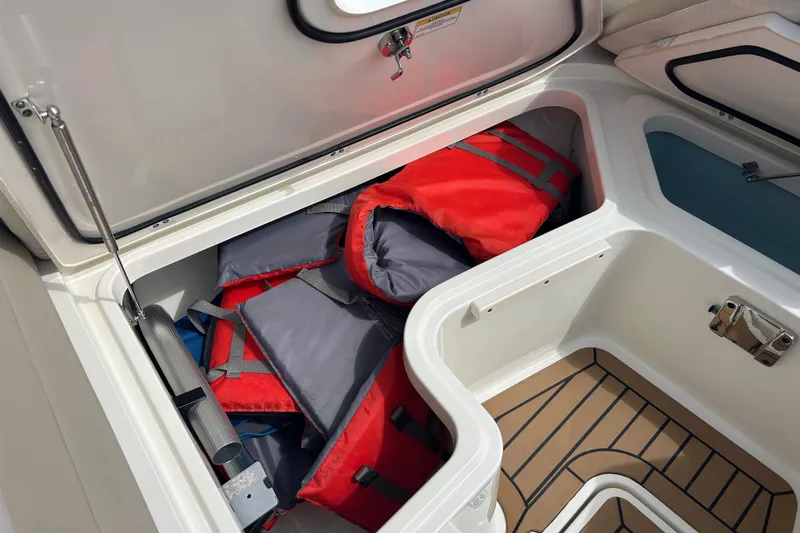  Yacht Photos Pics Storage compartment with life jackets on a 2017 Boston Whaler 320 Vantage boat.